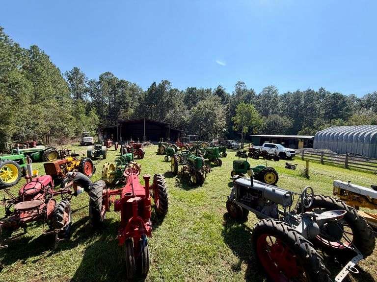 Field of antique John Deere and Farmall tractors lined up at the John Borne Estate in Lacombe, Louisiana