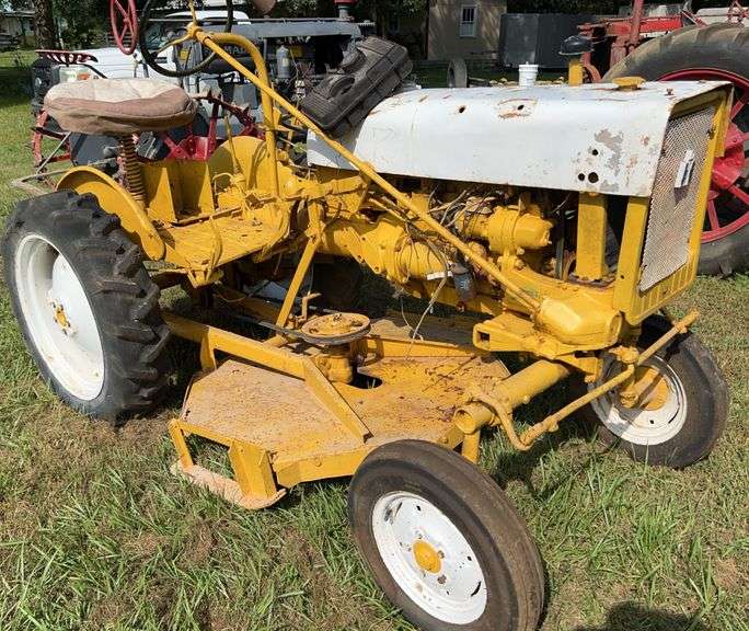 Yellow International Cub tractor with belly mower, John Borne Estate antique tractor auction