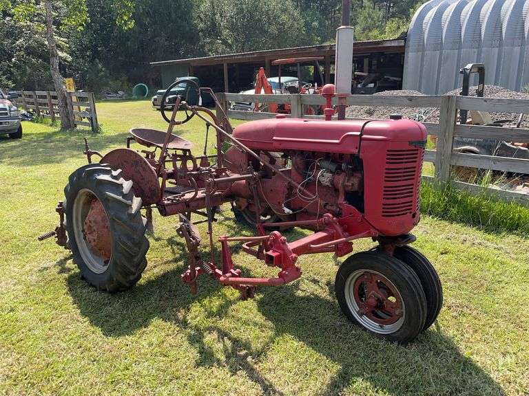 Red Farmall tractor with front cultivators, John Borne Estate antique tractor auction