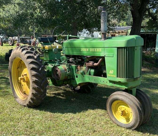 Green John Deere Model 60 tractor with yellow wheels and power steering, John Borne Estate antique tractor auction