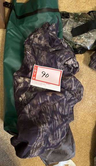 Cabela’s bag with camo clothing