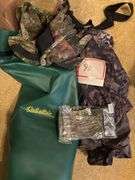 Cabela’s bag with camo clothing