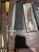 Hunting knife, folding knife, arrows, and camouflage paint