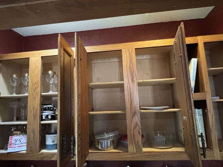 Contents of above cupboards, Cookbook, glassware, mugs, etc.