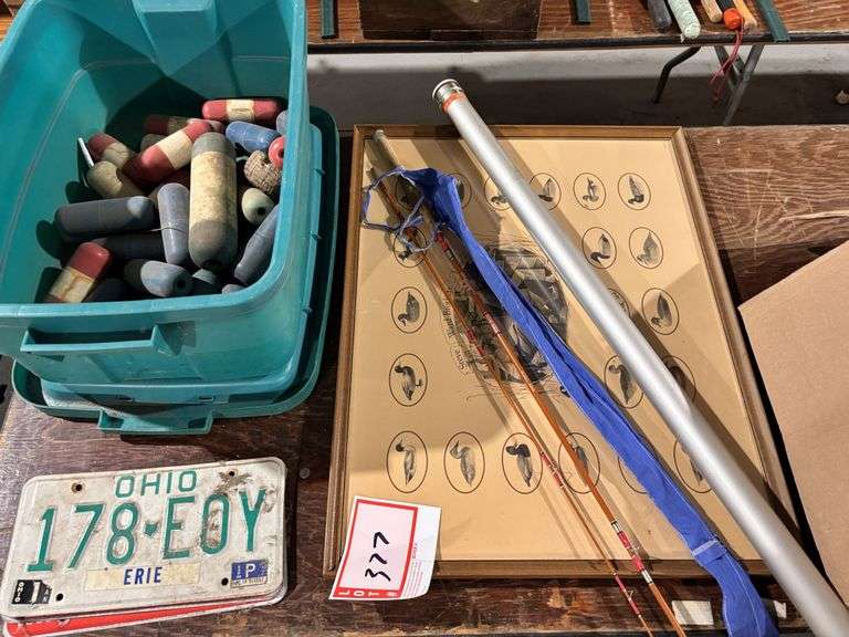 1.75 ounce fishing rod with aluminum container, duck picture, tote, and rope robbers