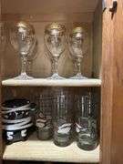 Contents of above cupboards, Cookbook, glassware, mugs, etc.