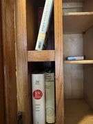 Contents of above cupboards, Cookbook, glassware, mugs, etc.