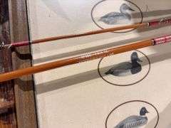 1.75 ounce fishing rod with aluminum container, duck picture, tote, and rope robbers