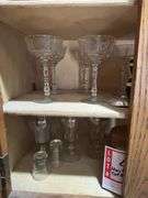Contents of above cupboards, Cookbook, glassware, mugs, etc.