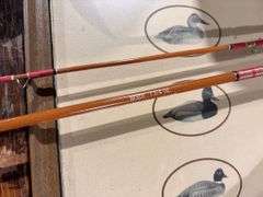 1.75 ounce fishing rod with aluminum container, duck picture, tote, and rope robbers