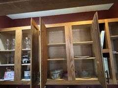 Contents of above cupboards, Cookbook, glassware, mugs, etc.