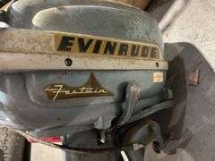 Evanrude Super Fastwin boat motor, battery, and gas cans