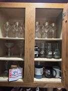 Contents of above cupboards, Cookbook, glassware, mugs, etc.