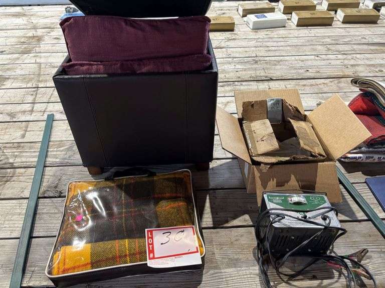 Battery charger, blanket, ottoman with pillow storage and pillow pillows