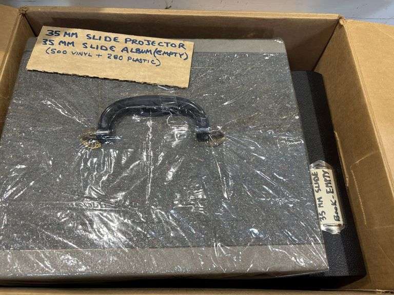 35 mm slide, projector and empty slide album, telephones