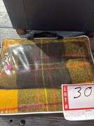 Battery charger, blanket, ottoman with pillow storage and pillow pillows