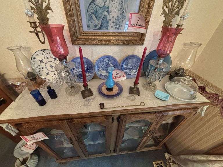 Items on top of China cabinet, decorative plates, lamps, Oil lamps