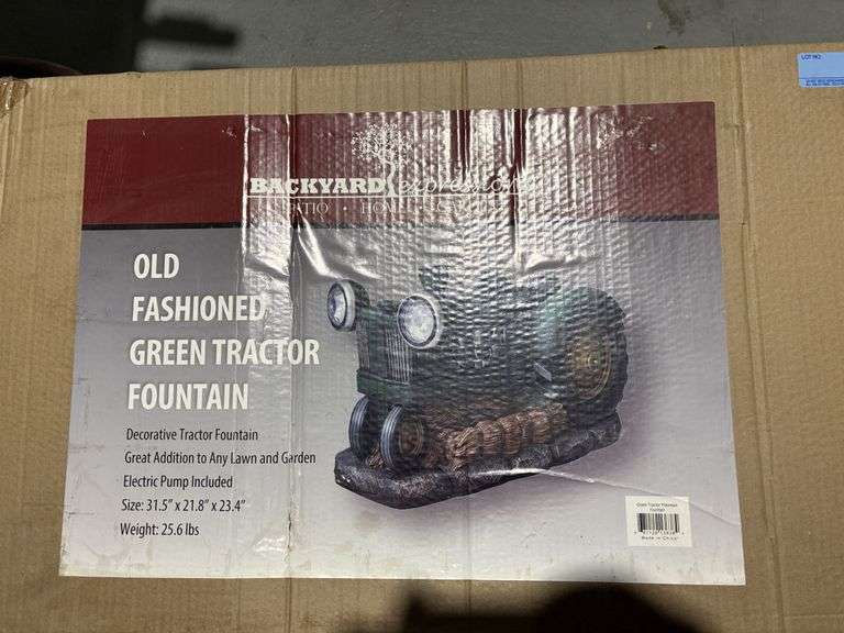 Old-fashioned green Tractor fountain