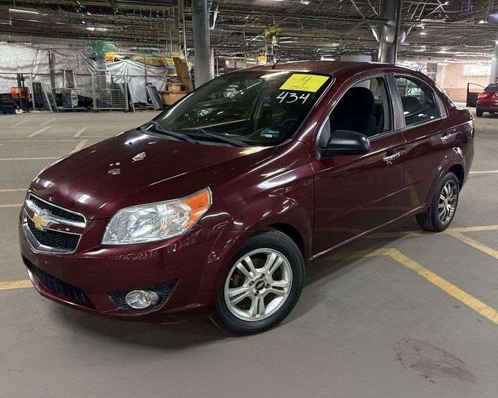Vehículo Usado Marca CHEVROLET, Modelo AVEO, Año 2017, Color VINO, No. De Serie