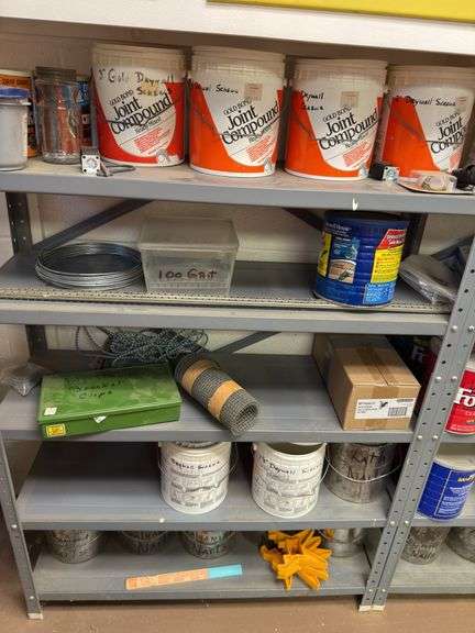 Contents of two sections of shelving, drywall screws, batteries, plate, joining biscuits, sandpaper