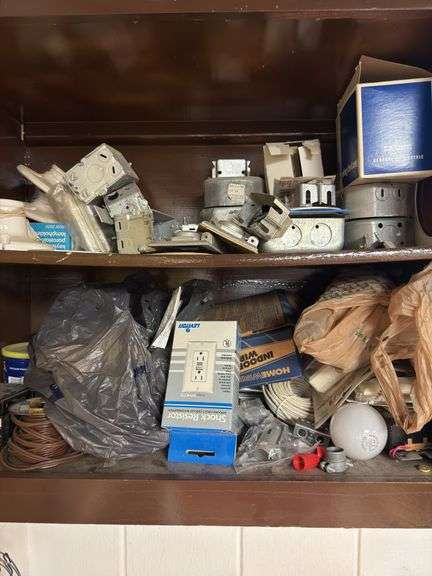 Cabinet full of electrical items, boxes, breakers,