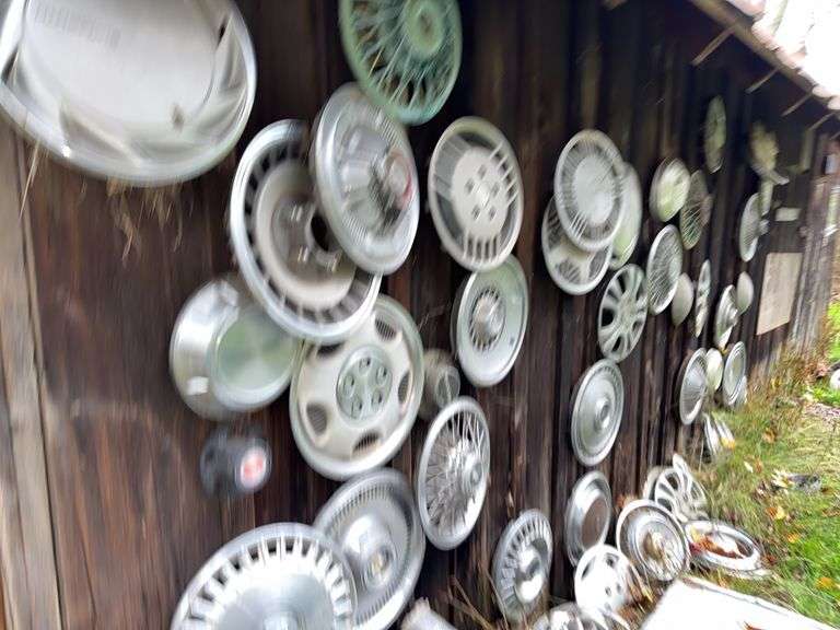 Hub Caps on side of Barn