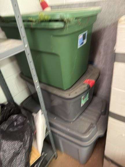 Three storage totes one with Christmas items