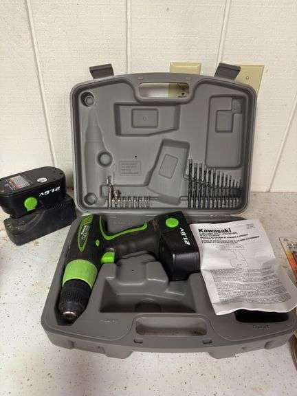 Kawasaki 21.6 V drill kit with two batteries and a charger case and drillbits and screwdriver heads