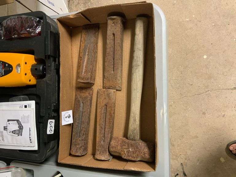 Box of metal wedges and hammer