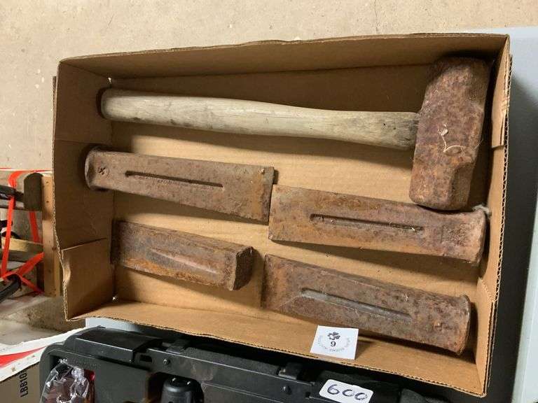 Box of metal wedges and hammer