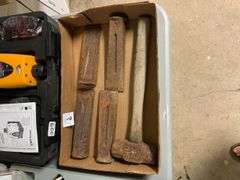 Box of metal wedges and hammer