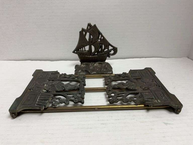 Brass bookend on a rail base - the ends will lay flat