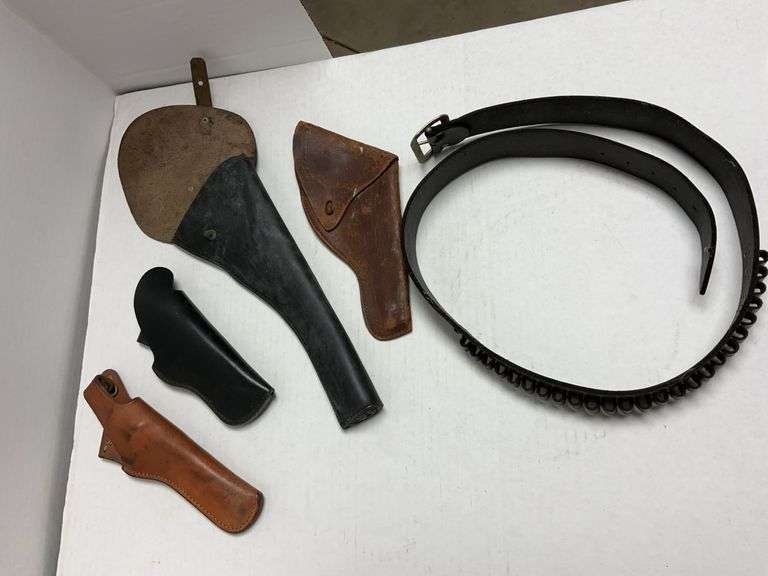 4 vintage leather holsters and a Lawrence 7D -XL 38 cal ammo pistol belt,