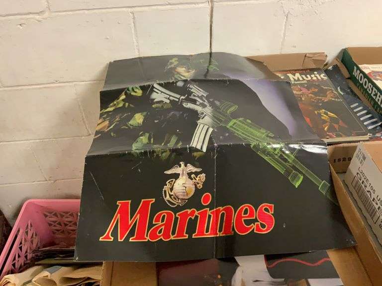2 marines posters that have been folded￼