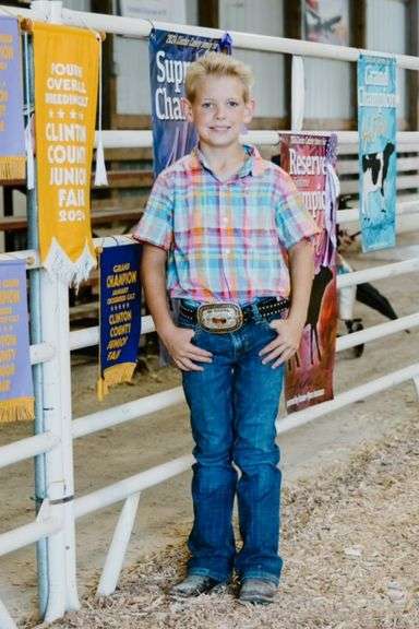 Carson  Bickel  Grand Supreme Junior Champion Heifer
