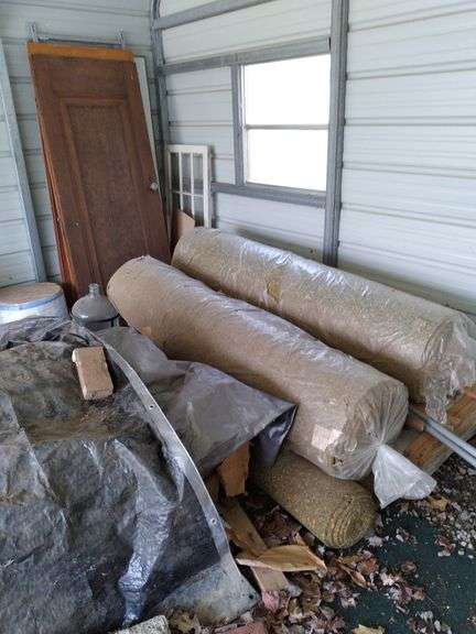 Contents of carport includes aluminum extension ladder, some furniture, vintage lawn decor, water bottle, doors. Take what you want leave the rest