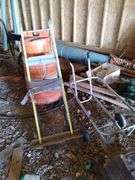 Barn: Appliance dolly, trashcan dolly, firewood dolly, Road barrel, also includes two by fours, drain pipe, cast iron, particleboard, lot of aluminum and wood doors.