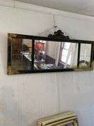 Family room: vintage parlor mirror with some spray paint, Leaded glass cabinet door, marble table top.