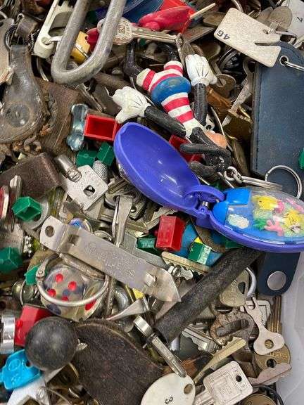 Large lot of very miscellaneous items. Keys. Accessories. Belt buckles. Film roll. Wallet. Decor. Vintage Christmas lights. Dice and much much more.