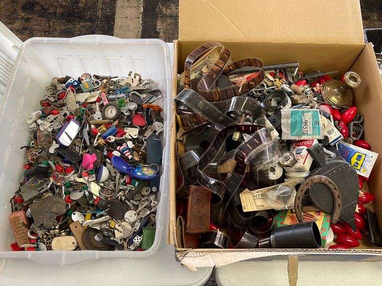 Large lot of very miscellaneous items. Keys. Accessories. Belt buckles. Film roll. Wallet. Decor. Vintage Christmas lights. Dice and much much more.