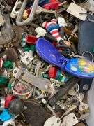 Large lot of very miscellaneous items. Keys. Accessories. Belt buckles. Film roll. Wallet. Decor. Vintage Christmas lights. Dice and much much more.