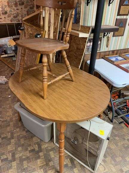 Small wooden table approximately 39 inches long with one chair and metal box van