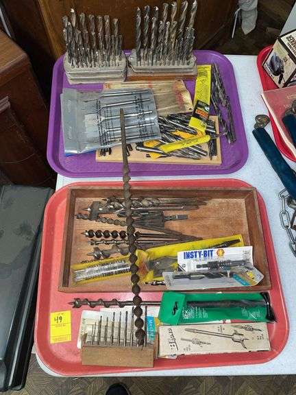 Basement. Two trays of drillbits, varying sizes and design designs.