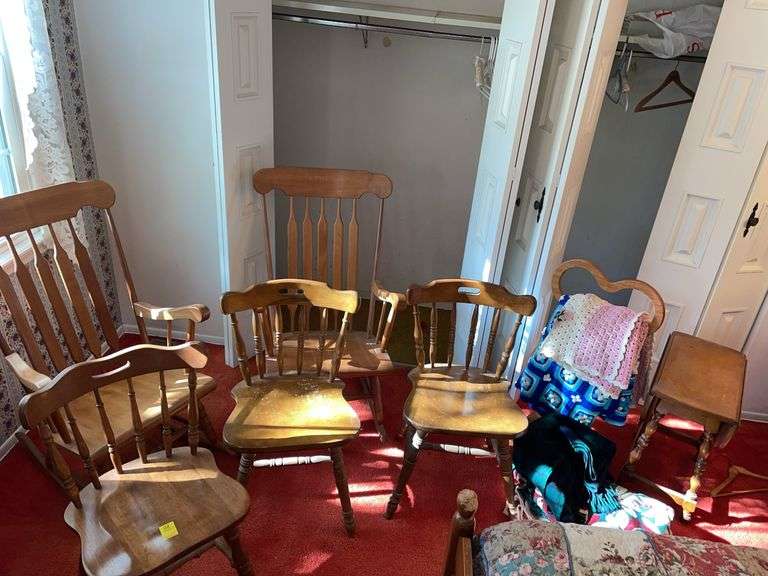 Bedroom. Large lot of chairs. Side table and quilt rack with quilts.