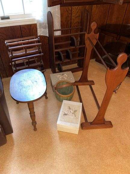 Den. Lot of miscellaneous furniture pieces. Quilt rack. DVD holder. Magazine rack. Small table and miscellaneous.