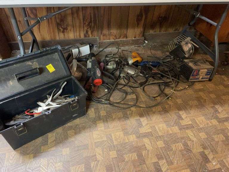Basement. Enormous tool lot. Featuring electric drills, stapler, floodlight trickle charger, saws, heat guns, a toolbox with pliers and other miscellaneous items. All for one money.