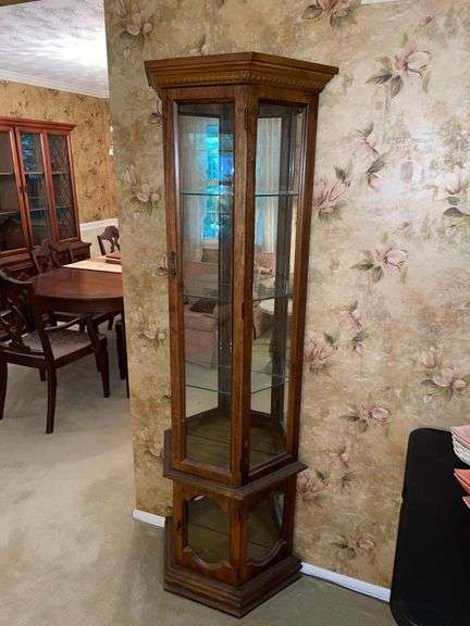 Standing curio cabinet 6 feet tall.