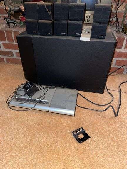 Den. Bose speakers, subwoofer, and CD player. 