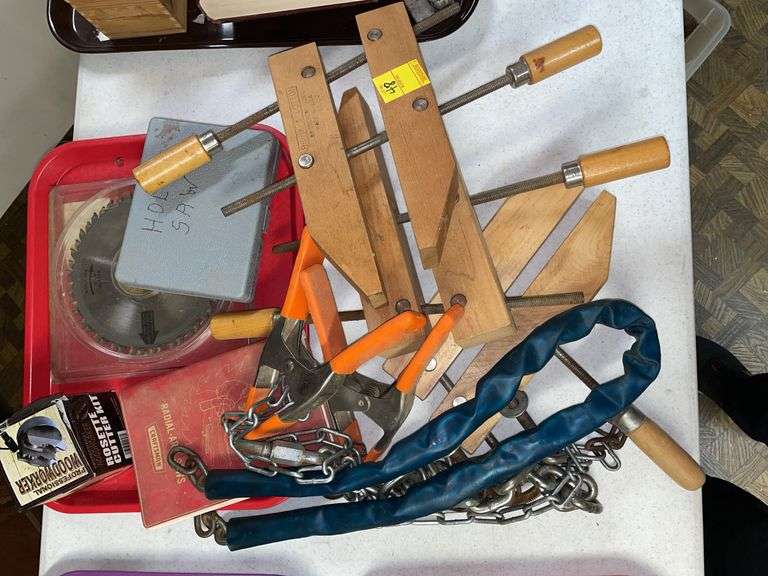 Basement. Lot of miscellaneous items. Saw blades. Chains. Clamps. Brink and cotton wooden clamps.