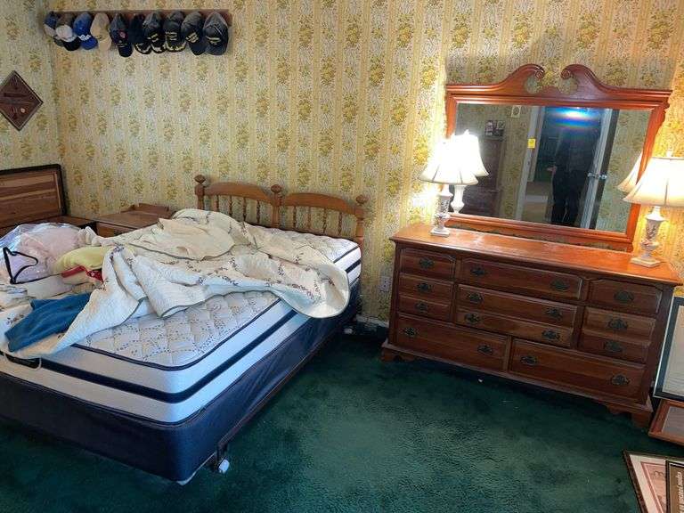Master bedroom bedroom set. Featuring dresser, nightstand dresser with mirror, two lamps and beauty, rest queen, size mattress, and frame.